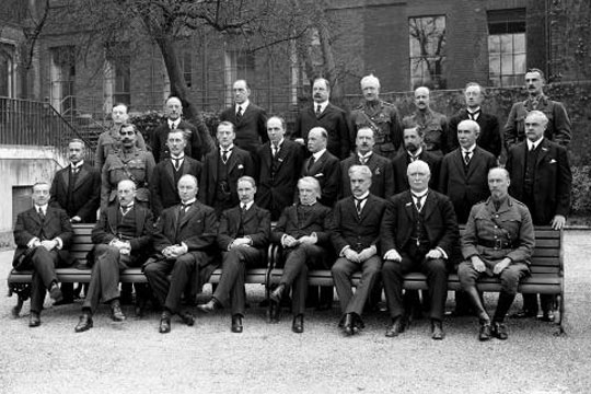 The Imperial War Cabinet seated and standing for a formal group photograph. 