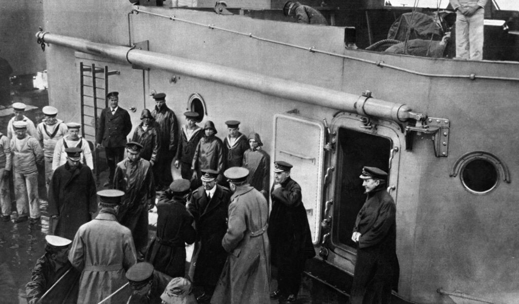 Admiral John Rushworth Jellicoe waving his farewell just as his gets onboard the boat/warship