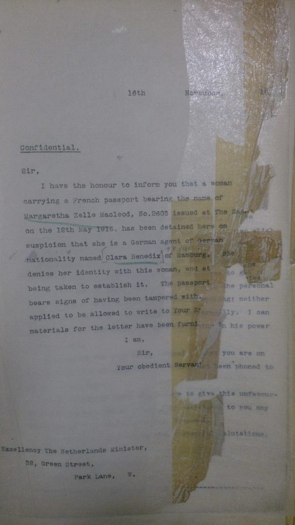 A confident letter saying: 'Sir, I have the honour to inform you that a woman carrying a french passport bearing the name of Margaretha Zells Macleod, No.2605 issues at The Hague on the 12 May 1916, has been detained her on suspicion that she is a German agent of German nationality named Clars Benedix of Hamburg. She denied her identity with this woman, and at risk of being taken to establish it. The passport bears signs of having been tampered with. ... applied to be allowed to write to Your E... materials for the letter have been furnished. I am, Sir, Your obedient servant